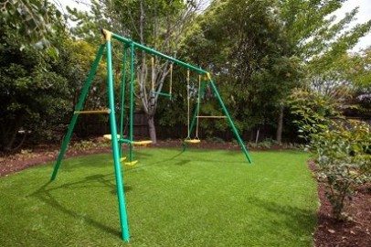 swing set, lawn, grass, turf, artificial turf, irrigation, sprinkler, pop-up sprinklers